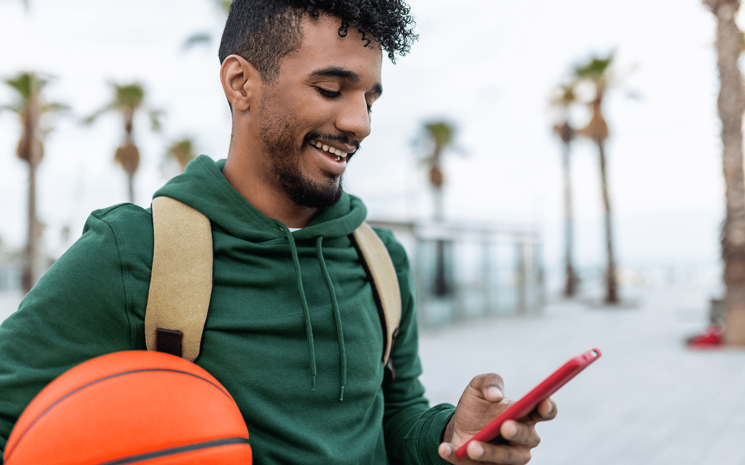 person smiling at their phone