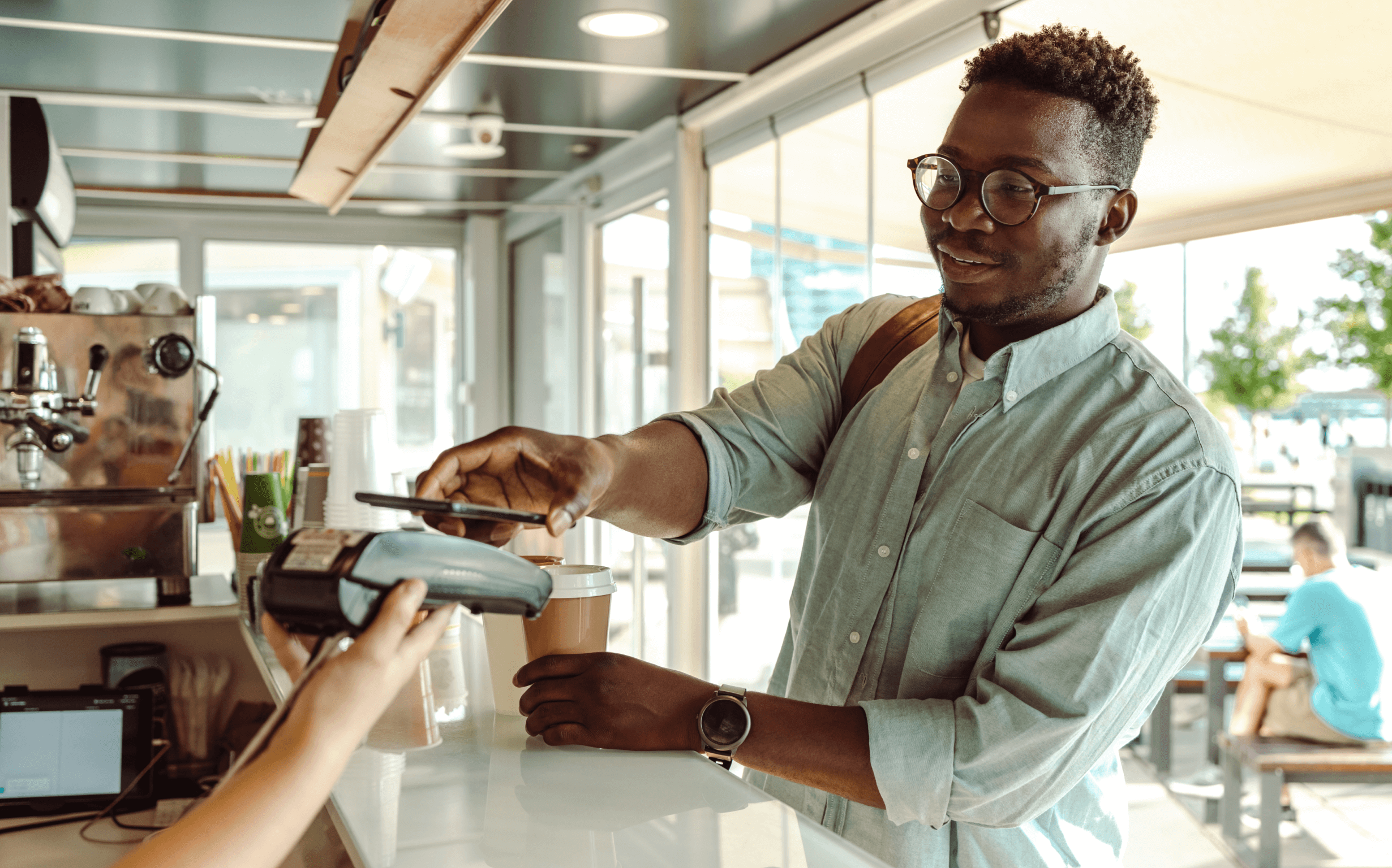 Man using iphone apple pay